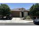 Charming single-story home with a well-manicured lawn and a two-car garage at 25931 W Deer Valley Rd, Buckeye, AZ 85396