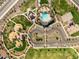 Aerial view of community amenities, including a pool, park, playground, parking, and recreational spaces for residents at 2644 E Grenache Rd, San Tan Valley, AZ 85143