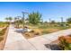 Peaceful community park with walking path, benches, and shaded seating areas at 2644 E Grenache Rd, San Tan Valley, AZ 85143