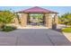 Stone picnic pavilion with picnic tables offers an inviting outdoor space for community gatherings and Gathering meals at 2644 E Grenache Rd, San Tan Valley, AZ 85143