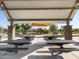 Well-maintained covered picnic area with tables, playground, and grassy spaces for Gathering gatherings and outdoor enjoyment at 2644 E Grenache Rd, San Tan Valley, AZ 85143