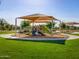Well-equipped, shaded playground with slides, ladders, and soft landing for community fun and activities for all ages at 2644 E Grenache Rd, San Tan Valley, AZ 85143