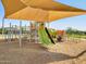 This modern playground features a slide, climbing structures, and more, all covered for sun protection at 2644 E Grenache Rd, San Tan Valley, AZ 85143