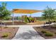 This covered playground features climbing structures, slides, and more for active fun in the neighborhood at 2644 E Grenache Rd, San Tan Valley, AZ 85143