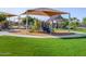 Shaded playground with play structures and open green space for community fun and neighborhood activities at 2644 E Grenache Rd, San Tan Valley, AZ 85143