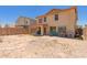 Large backyard with desert landscaping, patio area, and privacy wall at 298 W Dana Dr, San Tan Valley, AZ 85143