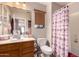 Charming bathroom with decorative shower curtain, vanity, and vanity mirror at 298 W Dana Dr, San Tan Valley, AZ 85143