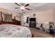 Spacious bedroom with neutral walls, ceiling fan and dark wood furniture at 298 W Dana Dr, San Tan Valley, AZ 85143