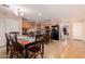 Spacious kitchen featuring wood cabinets, a black refrigerator, and tiled floors at 298 W Dana Dr, San Tan Valley, AZ 85143