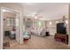 Cozy living room with ceiling fan, large windows, and comfortable seating area at 298 W Dana Dr, San Tan Valley, AZ 85143