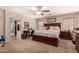 Comfortable main bedroom with neutral tones, a ceiling fan, and an attached bathroom at 298 W Dana Dr, San Tan Valley, AZ 85143
