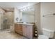 Luxurious bathroom featuring a double vanity, a glass-enclosed shower, and elegant fixtures at 310 S 4Th St # 1601, Phoenix, AZ 85004