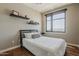 Bright bedroom with hardwood floors, a large window with stunning outdoor views, and contemporary decor at 310 S 4Th St # 1601, Phoenix, AZ 85004
