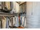 Custom closet with built-in shelving, drawers, and ample hanging space for organized storage at 310 S 4Th St # 1601, Phoenix, AZ 85004