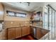 Modern kitchen featuring granite countertops, stainless steel appliances, wood cabinetry, and stylish backsplash at 310 S 4Th St # 1601, Phoenix, AZ 85004