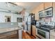 Contemporary kitchen featuring stainless steel appliances, light wood cabinets, and granite counters at 310 S 4Th St # 1601, Phoenix, AZ 85004