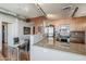 Modern kitchen with stone countertops, stainless appliances, and a dining area with seating at 310 S 4Th St # 1601, Phoenix, AZ 85004