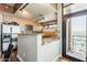 Bright kitchen featuring stainless steel appliances, light wood cabinets, and a breakfast bar with granite countertop at 310 S 4Th St # 1601, Phoenix, AZ 85004