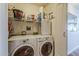 Practical laundry room features a modern washer and dryer and built-in storage at 310 S 4Th St # 1601, Phoenix, AZ 85004