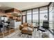Spacious living room features open design, hardwood floors, and large windows with mountain views at 310 S 4Th St # 1601, Phoenix, AZ 85004