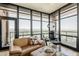 Cozy living room features lots of natural light, stylish furniture, and great city views at 310 S 4Th St # 1601, Phoenix, AZ 85004