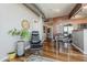 Bright and airy living space features a comfortable chair, hardwood floors, and an exposed duct at 310 S 4Th St # 1601, Phoenix, AZ 85004
