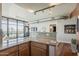 Open concept living room featuring hardwood floors, large windows with city views, and modern lighting at 310 S 4Th St # 1601, Phoenix, AZ 85004