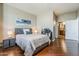 Well-lit bedroom with hardwood floors, comfortable furniture, and modern decor at 310 S 4Th St # 1601, Phoenix, AZ 85004