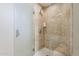 Walk-in shower featuring tile surround, rainfall shower head, and a glass door at 310 S 4Th St # 1601, Phoenix, AZ 85004