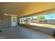 Covered back patio showing an outdoor space and view to the yard with trampoline at 3107 W Lisbon Ln, Phoenix, AZ 85053