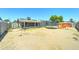 Full backyard view with a trampoline, shed, patio, and solar panels on the house at 3107 W Lisbon Ln, Phoenix, AZ 85053