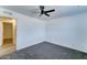 Bright bedroom with a ceiling fan and neutral carpet providing a comfortable living space at 3107 W Lisbon Ln, Phoenix, AZ 85053