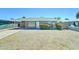Charming single-story home featuring a covered carport, low-maintenance landscaping, and a classic facade at 3107 W Lisbon Ln, Phoenix, AZ 85053