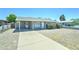 Cozy single-story home with a covered carport and a well-kept, low-maintenance front yard at 3107 W Lisbon Ln, Phoenix, AZ 85053