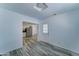 Open-concept space includes a view of the kitchen and a white door, providing a seamless flow and modern design at 3107 W Lisbon Ln, Phoenix, AZ 85053