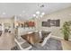 Dining room with modern chandelier conveniently located adjacent to kitchen with breakfast bar seating at 3131 E Legacy Dr # 1032, Phoenix, AZ 85042