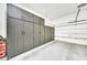 Clean, orderly garage with built-in cabinets for maximum storage, plus a two car garage door at 3131 E Legacy Dr # 1032, Phoenix, AZ 85042