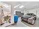 Spacious three car garage features storage cabinets, bright lighting, and ample room for vehicles at 3131 E Legacy Dr # 1032, Phoenix, AZ 85042