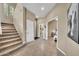Hallway leading to bedroom with en-suite bathroom and staircase to second floor, with golf art piece at 3131 E Legacy Dr # 1032, Phoenix, AZ 85042