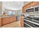 Well-equipped kitchen with stainless steel appliances, granite countertops, and ample cabinet space at 3131 E Legacy Dr # 1032, Phoenix, AZ 85042