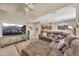 Spacious living room with vaulted ceilings, plush sectional, and a media center with a large screen TV at 3131 E Legacy Dr # 1032, Phoenix, AZ 85042