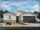 Charming single-story home featuring a stone-accented facade, neutral stucco, and a well-maintained front yard at 31391 N Pinot Dr, San Tan Valley, AZ 85143