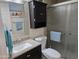 Bathroom with walk-in shower, neutral tiling, modern fixtures, and decorative wall art at 3330 E Main St # 121, Mesa, AZ 85213