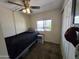 Cozy bedroom with neutral carpet, ample natural light, and functional furniture at 3330 E Main St # 121, Mesa, AZ 85213