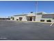 Community clubhouse with ample parking and an American flag waving high in the sky at 3330 E Main St # 121, Mesa, AZ 85213