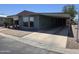 Inviting single-level home with a covered parking and easy-care rock garden at 3330 E Main St # 121, Mesa, AZ 85213