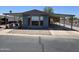 Charming single-story home featuring a covered carport and low-maintenance rock landscaping at 3330 E Main St # 121, Mesa, AZ 85213