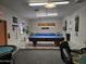 Bright game room featuring two pool tables and comfortable seating areas for entertainment at 3330 E Main St # 121, Mesa, AZ 85213