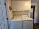 Laundry room featuring a side-by-side washer and dryer and ample storage at 3330 E Main St # 121, Mesa, AZ 85213