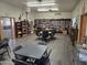Community library featuring cozy seating, tables, a large bookcase, and natural light at 3330 E Main St # 121, Mesa, AZ 85213